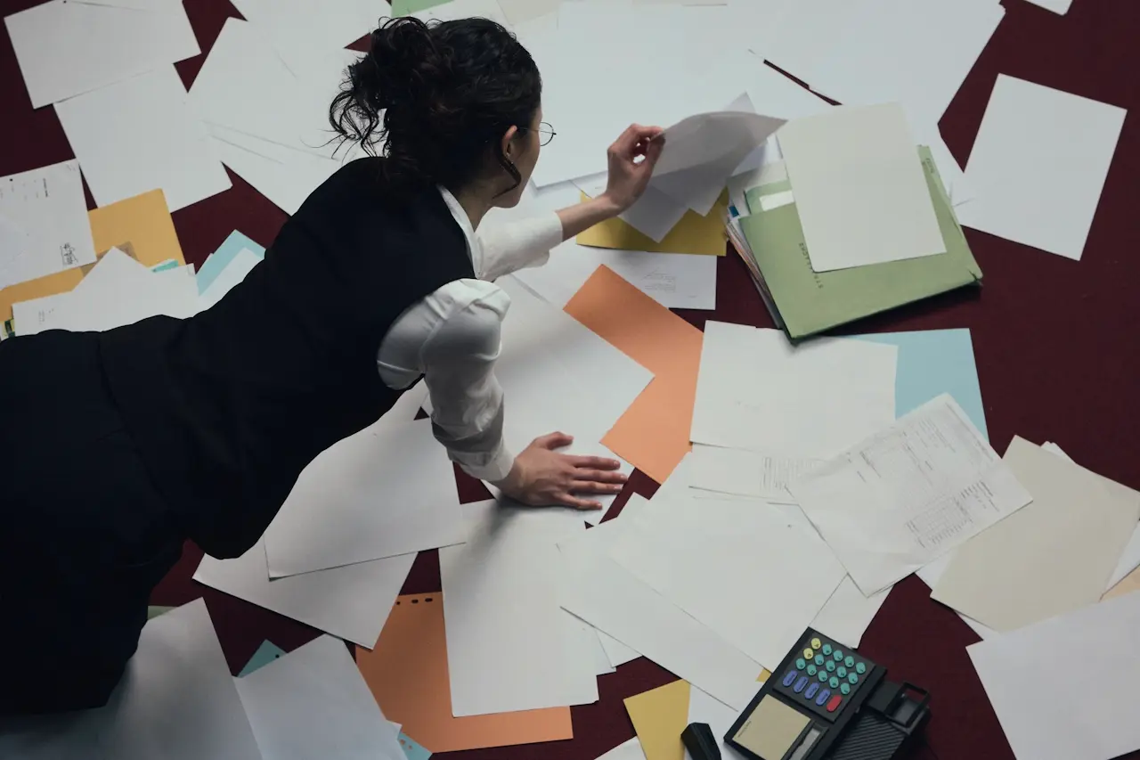 A woman surrounded by papers